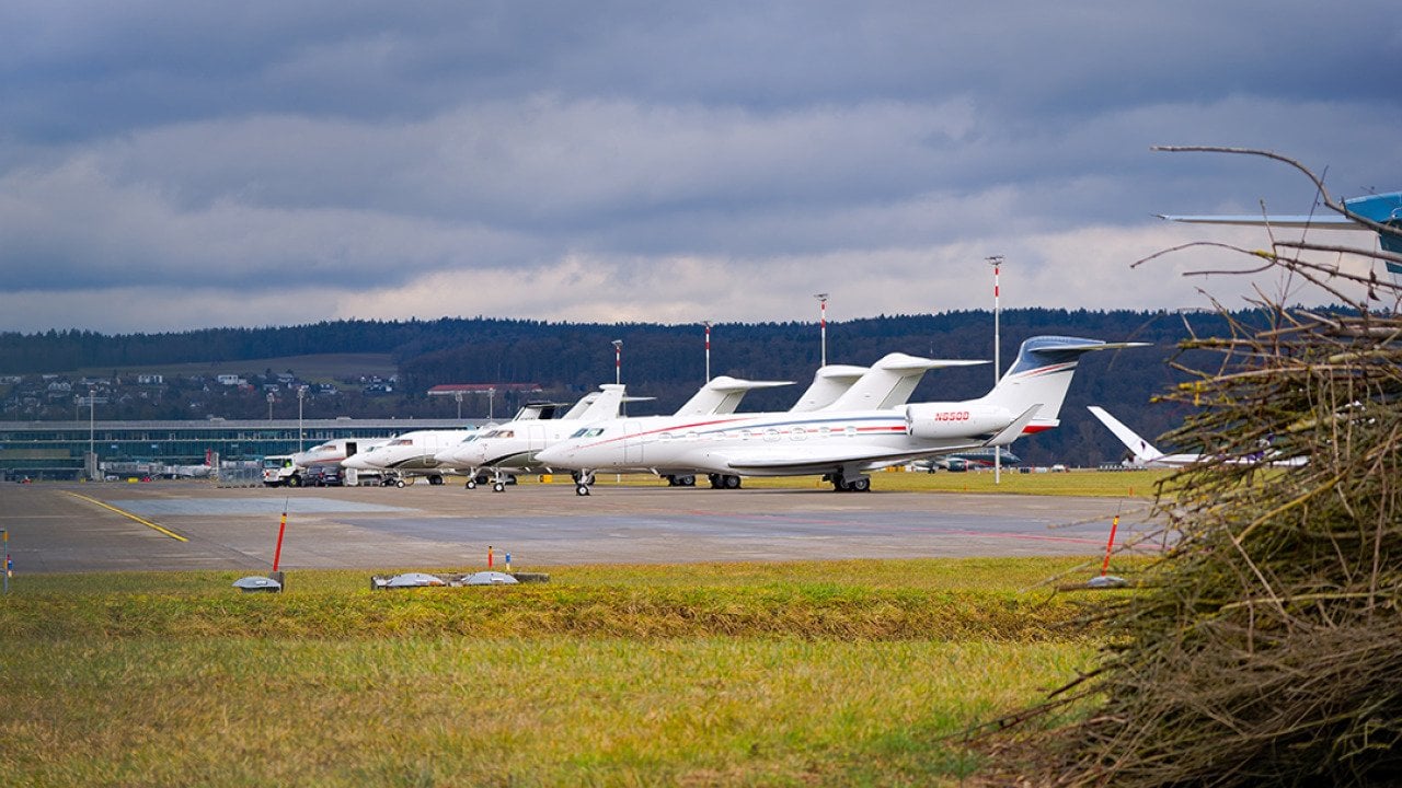 Private jets parked at a Swiss airport.