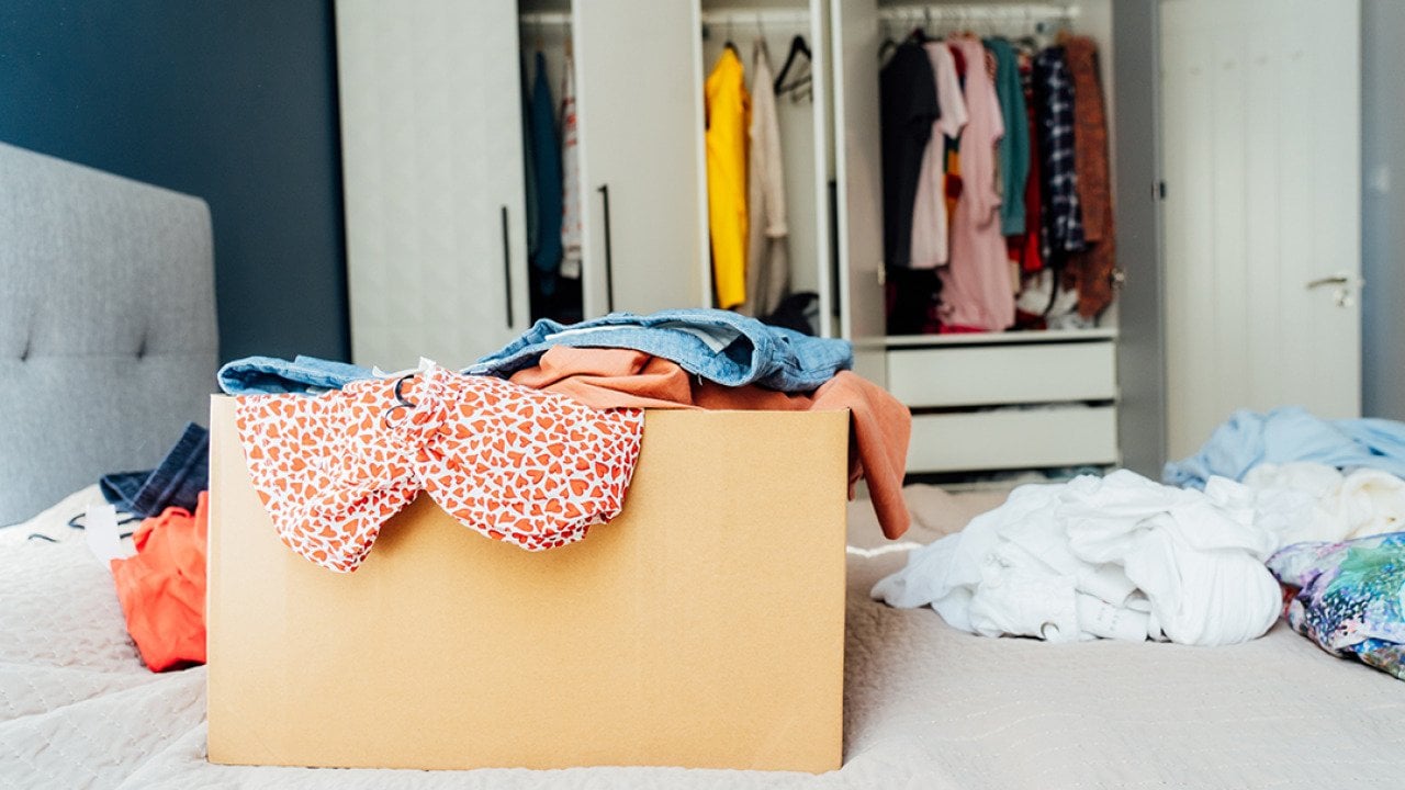 A box full of selected clothes from closet cleanup.