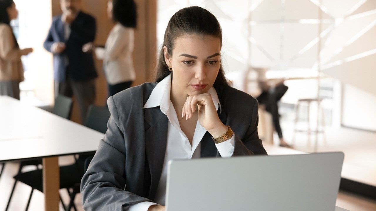 A young female professional working in a corporate office.