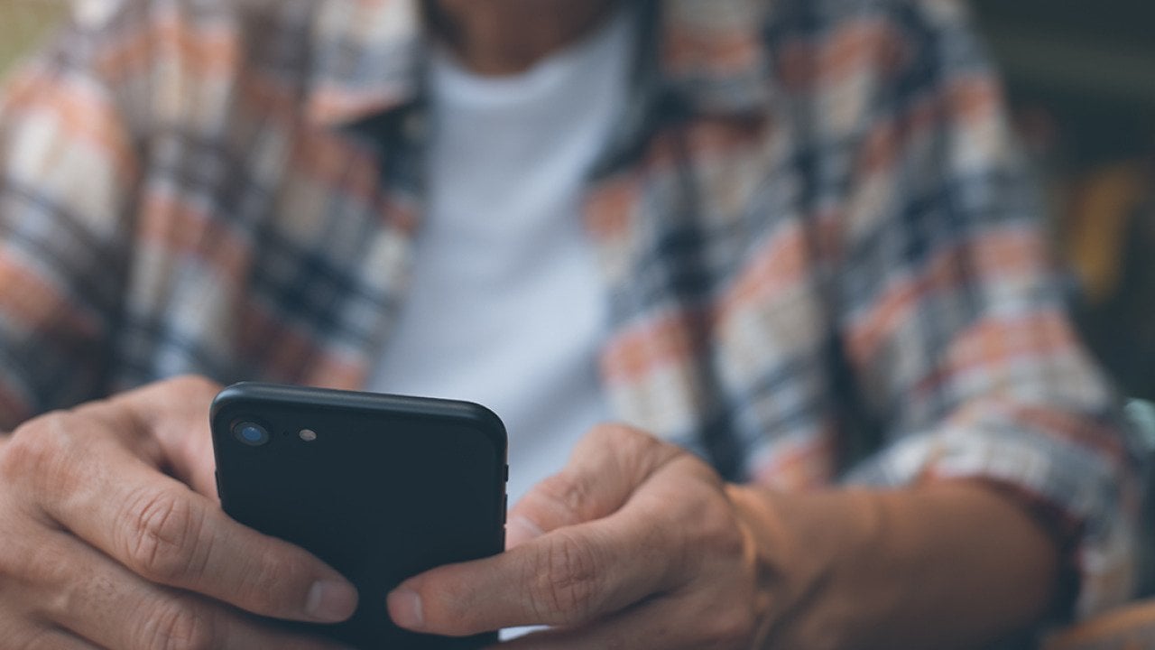 A man using a smartphone.