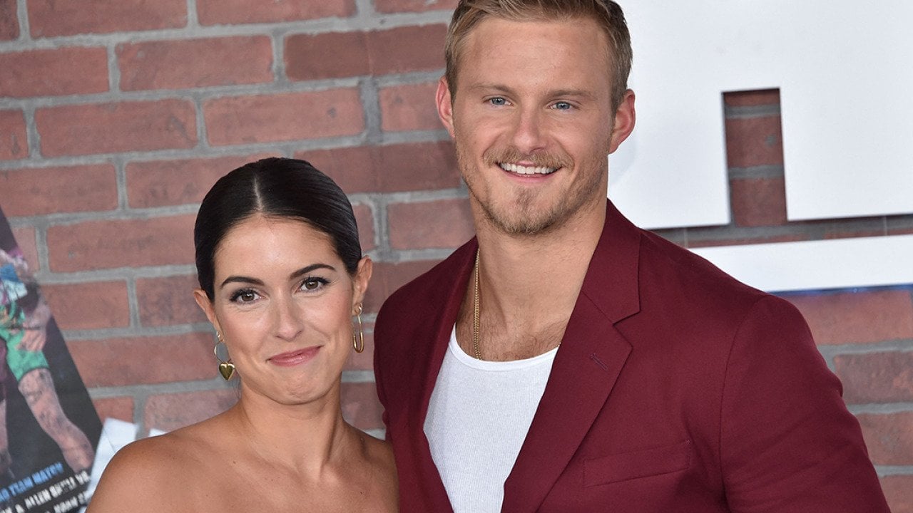 Actors Alexander Ludwig (R) and his wife Lauren Dear arrive for the premiere of