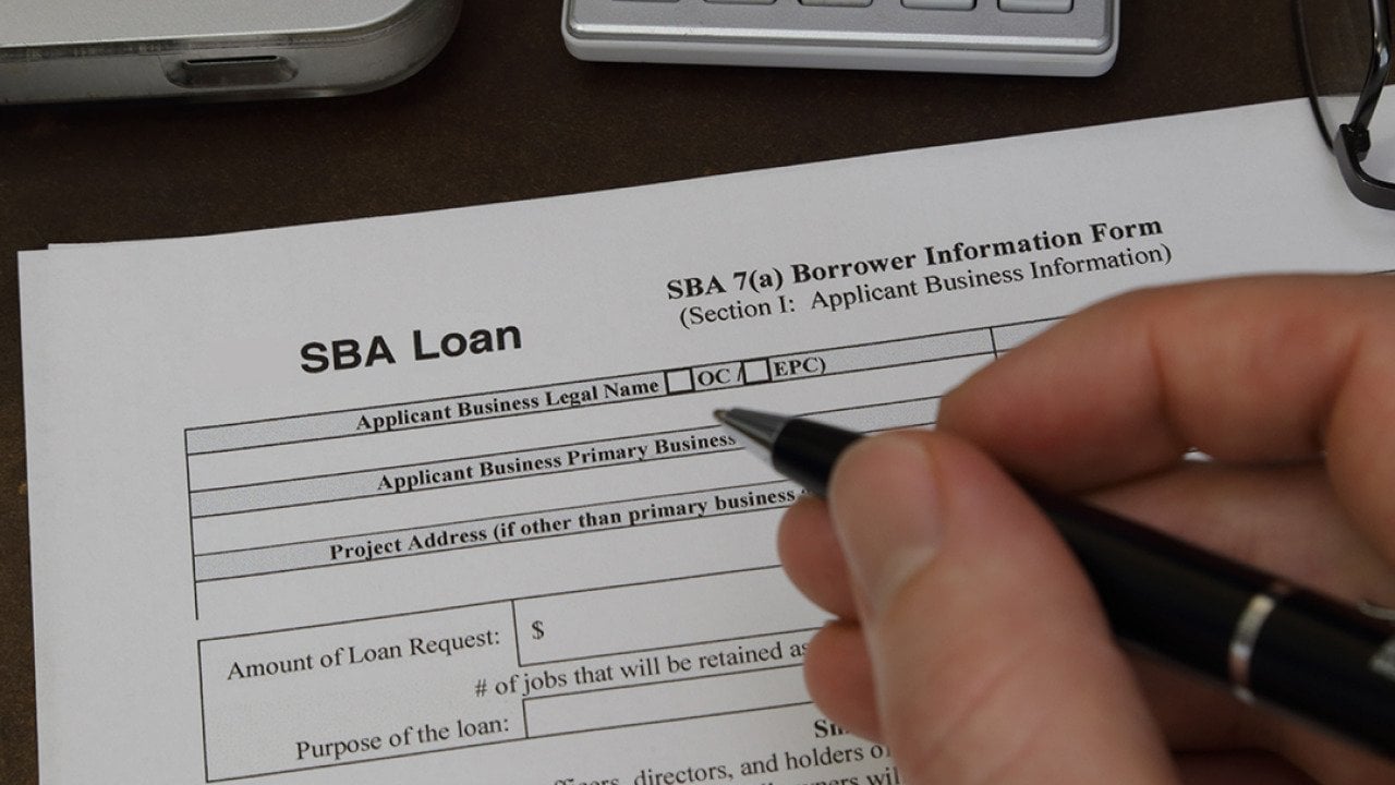 An SBA loan application form being filled out.