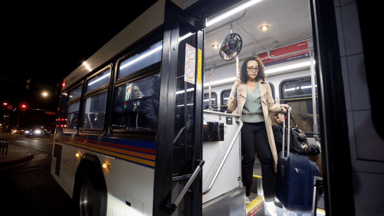 Cherri McKinney rides the bus home from her office in Denver using an EcoPass, a free monthly RTD pass, provided to Colorado state employees.