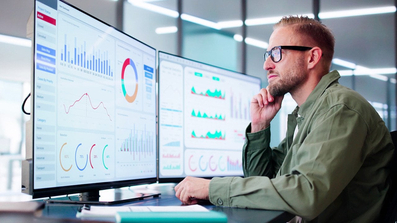 A data analyst reviewing dashboards.