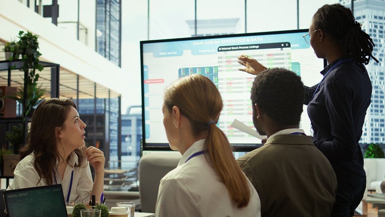 An accounting team reviewing budget and financial reports.