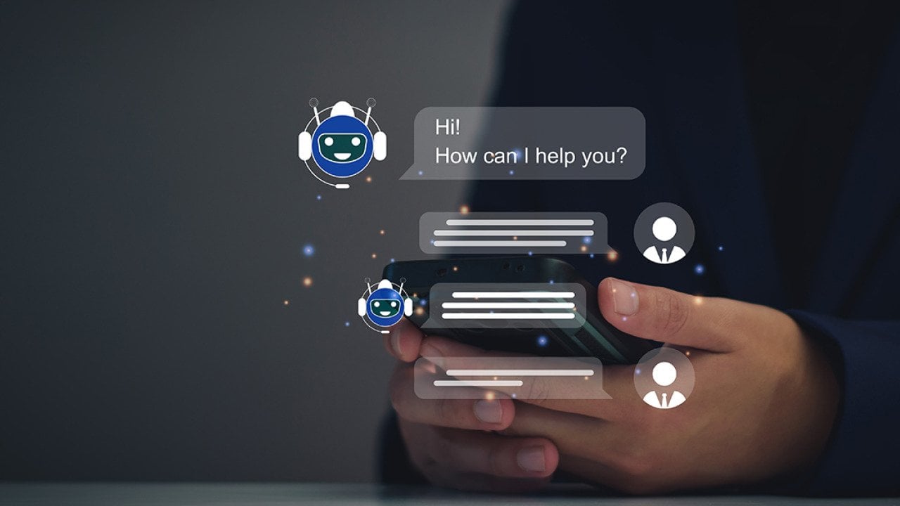 AI chatbot graphics over a person using a smartphone.