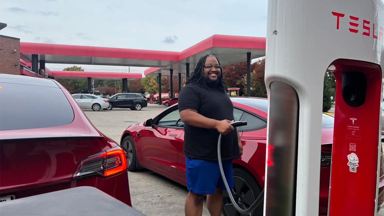 Phillip Stafford charges his car with a Tesla charger at his preferred gas station, Sheetz.
