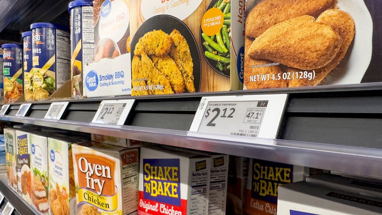 Digital price tags on display for the seasoning mix shelf in a grocery.