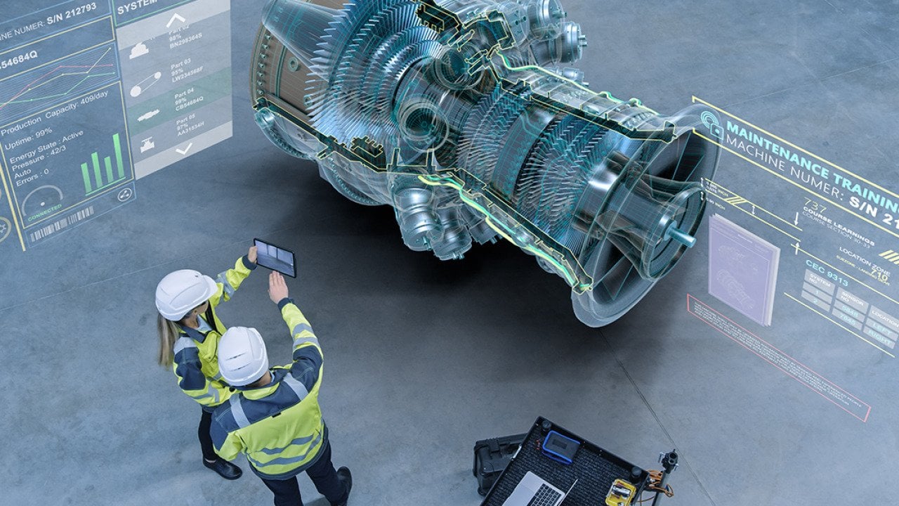 Aircraft engineers using augmented reality software for jet engine diagnostics.