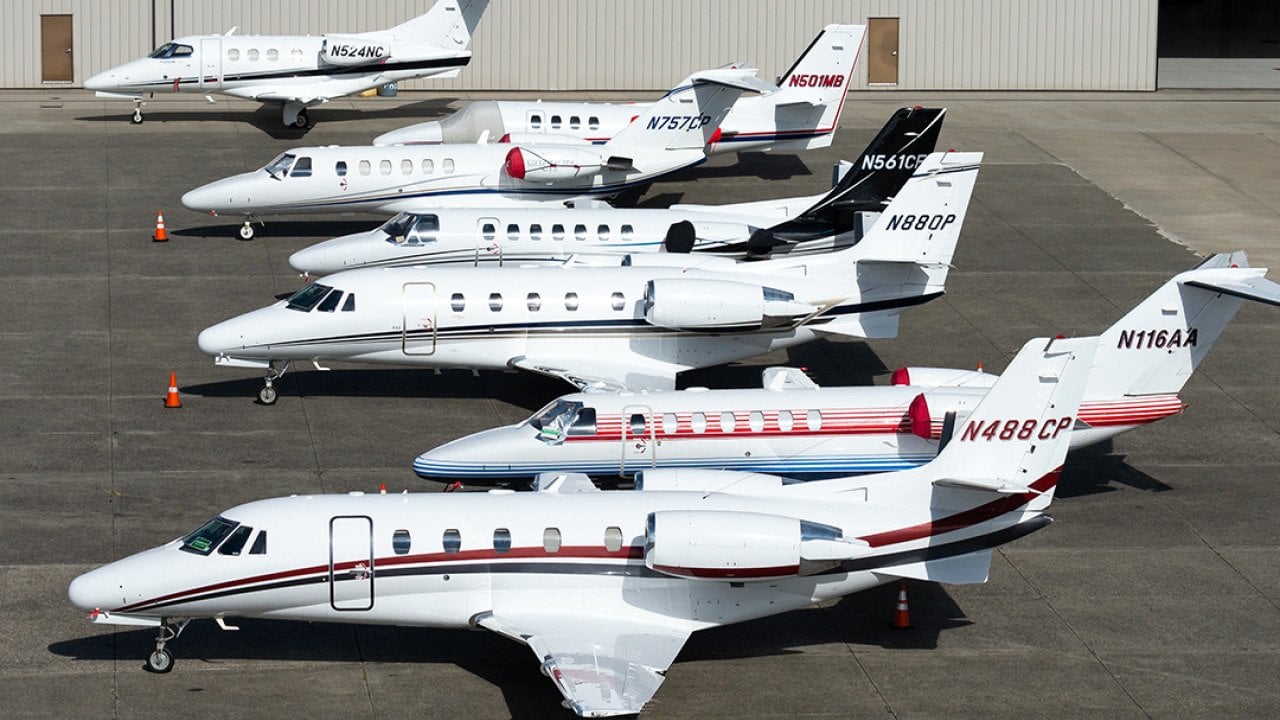 A row of private business jets in an airport in King County, Seattle.