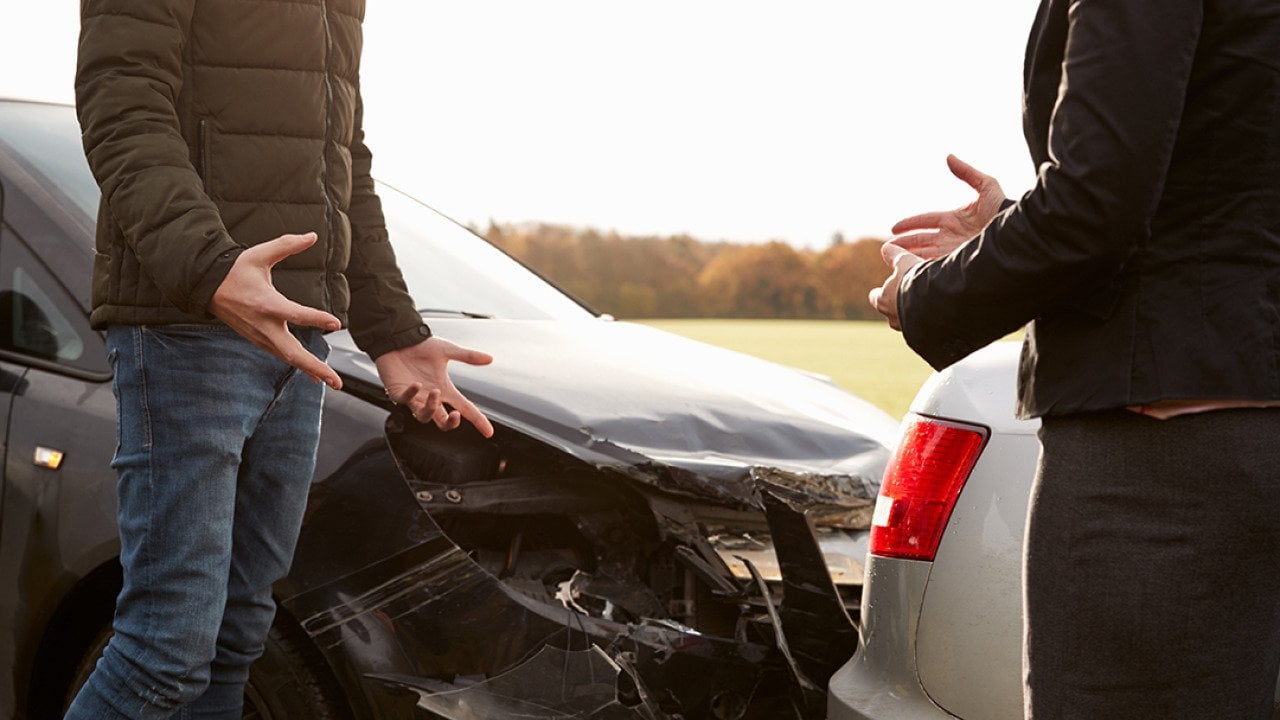 Two drivers arguing after a road accident.
