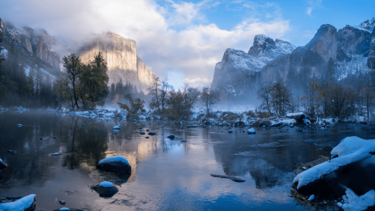 A lake and mountains in the background in Yosemite National Park in California in winter.