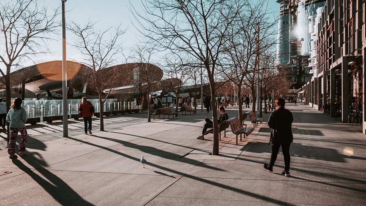 People along a walkway during wintertime.