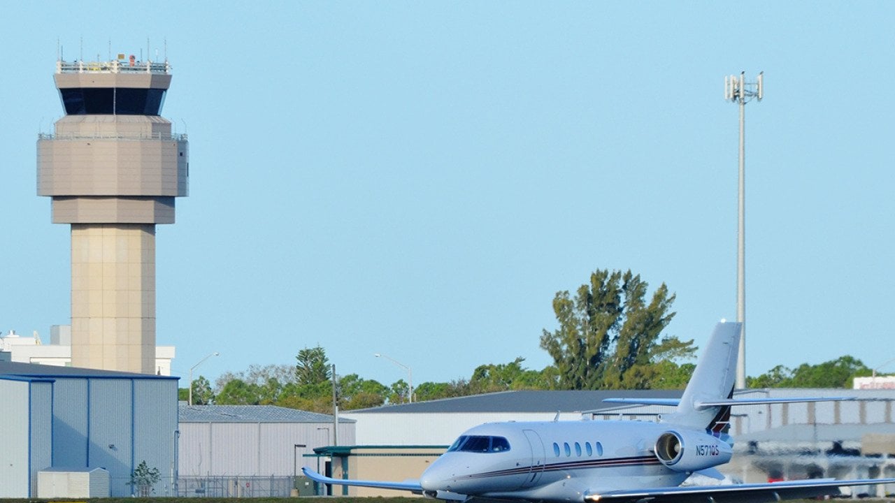 A private Charter Cessna Citation Latitude Jet on a runway in Sarasota-Bradenton International Airport.