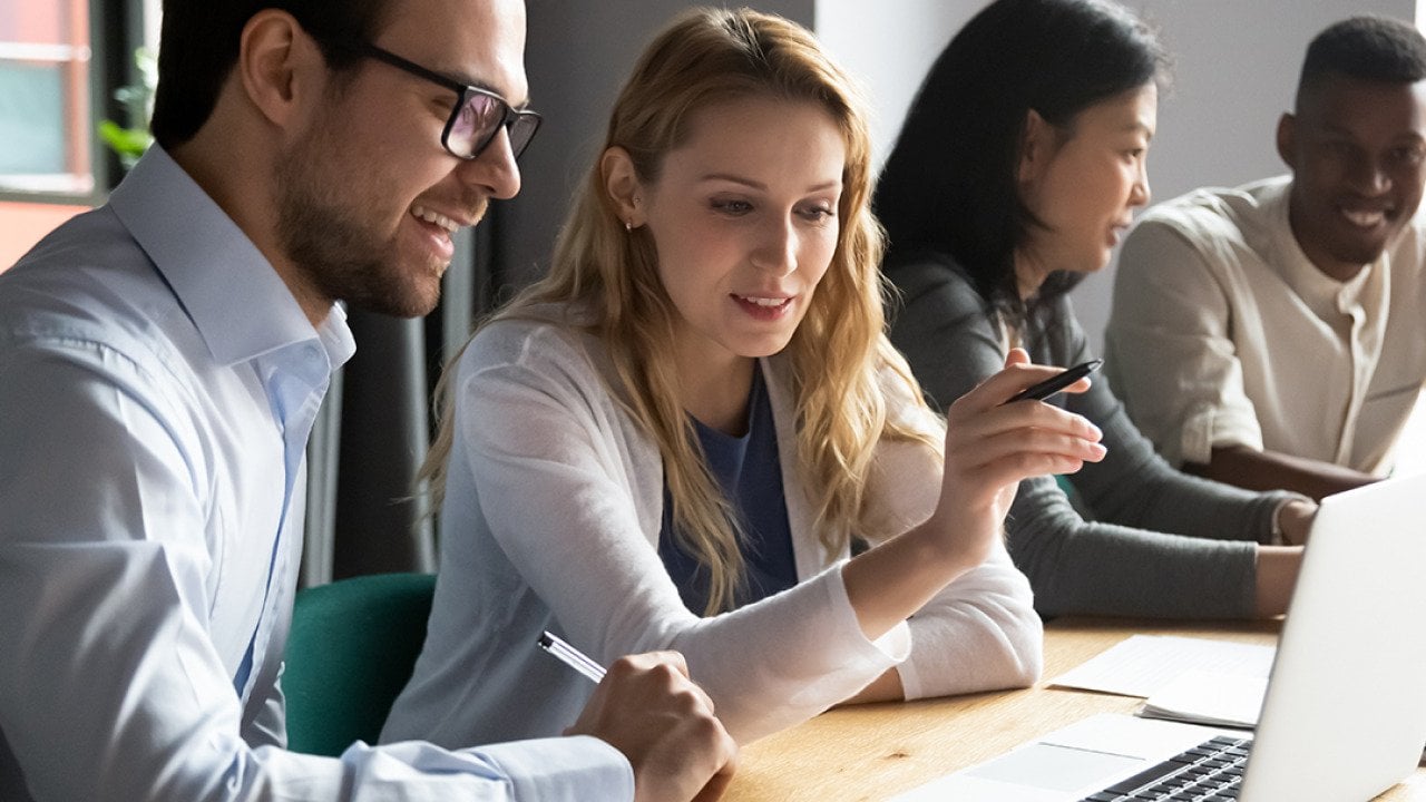 A diverse corporate team working together on a project.