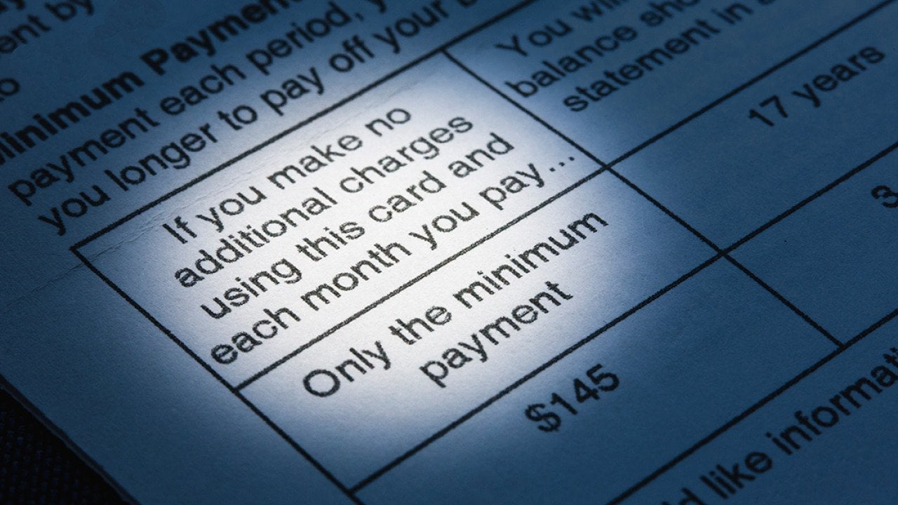 A close up view on the minimum payment terms in a credit card bill.