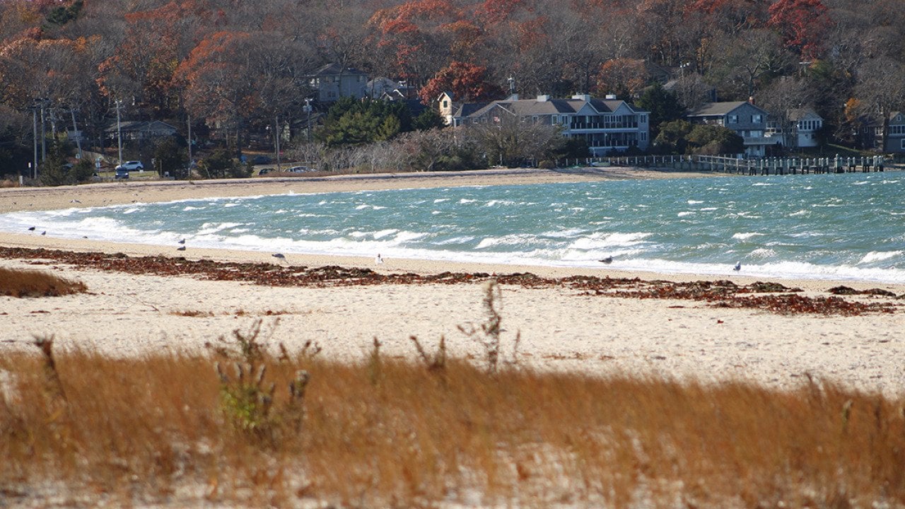 Luxury homes along the Noyac Bay beach in Sag Harbor, New York during winter.
