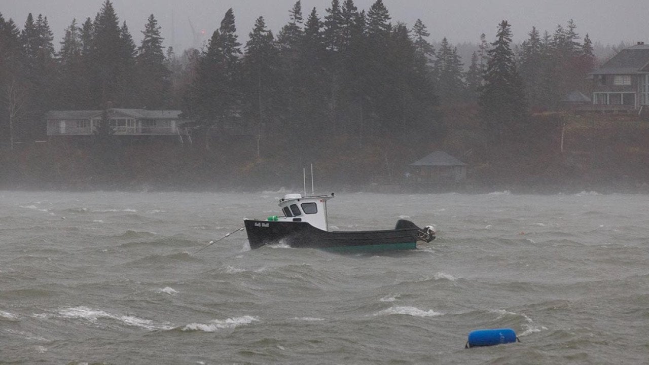 A lobster boat at sea during a storm in the North Haven Harbor, Maine.