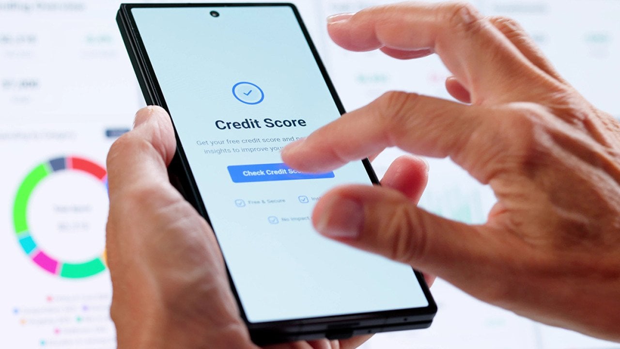 Person checking credit score online using smartphone.