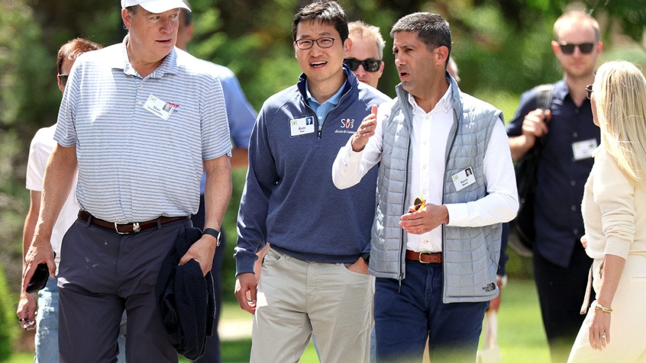 Bom Kim (center), founder and CEO of Coupang, walks with investor Stan Druckenmiller and member of the Federal Reserve Board of Governors Kevin Warsh during the Allen & Company's annual Sun Valley Conference on July 13, 2023 in Sun Valley, Idaho.