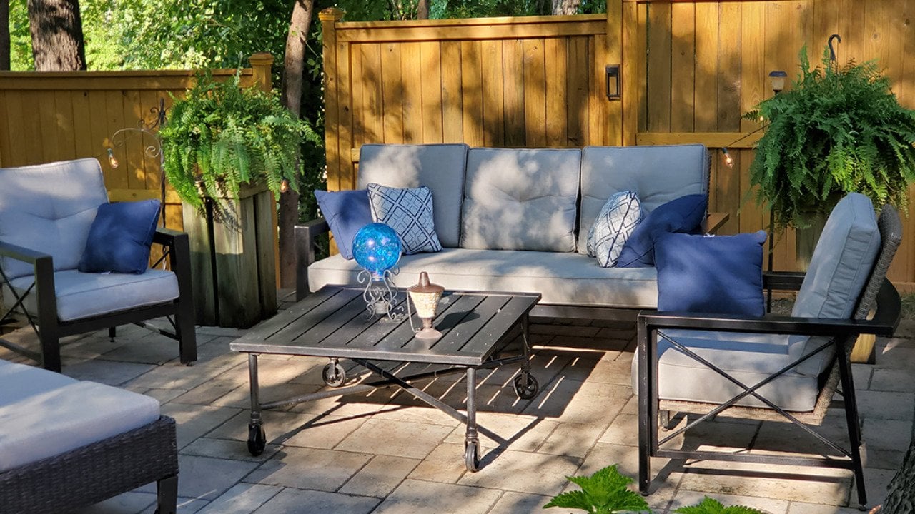 A patio with modern furniture during the afternoon.