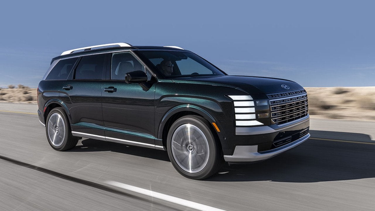 A Hyundai Palisade Hybrid SUV on the road.