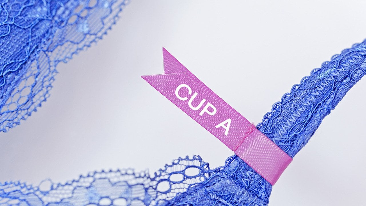 A pink 'cup A' label on a lace bra.