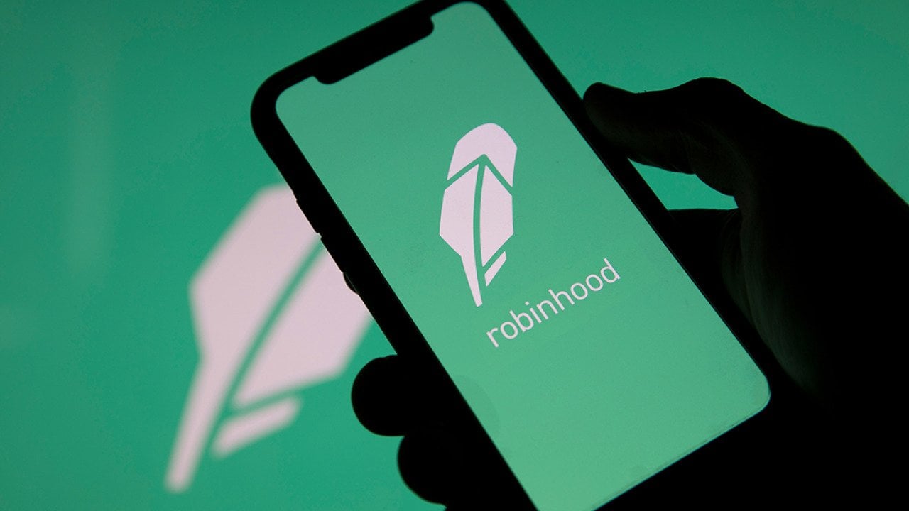 Robinhood, a financial investing app, and its logo displayed on a smartphone.