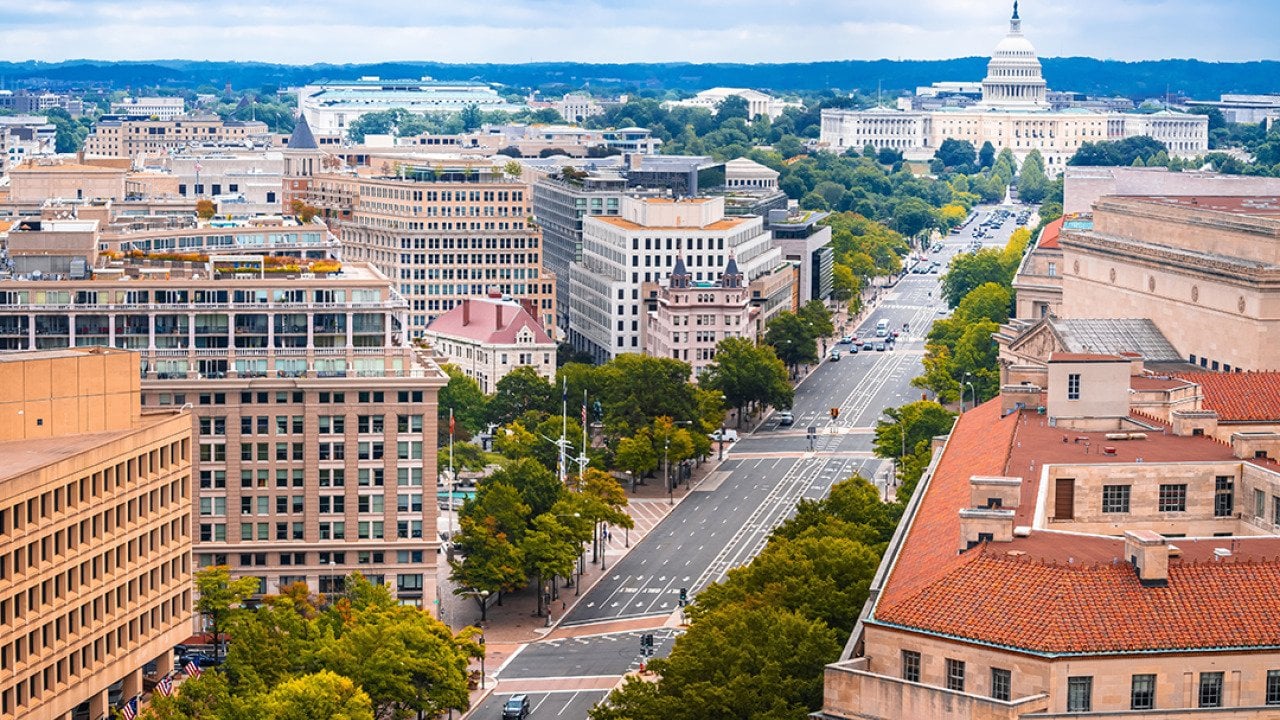 An aerial shot of Pennsylvania Avenue and a view of U.S. Capitol.