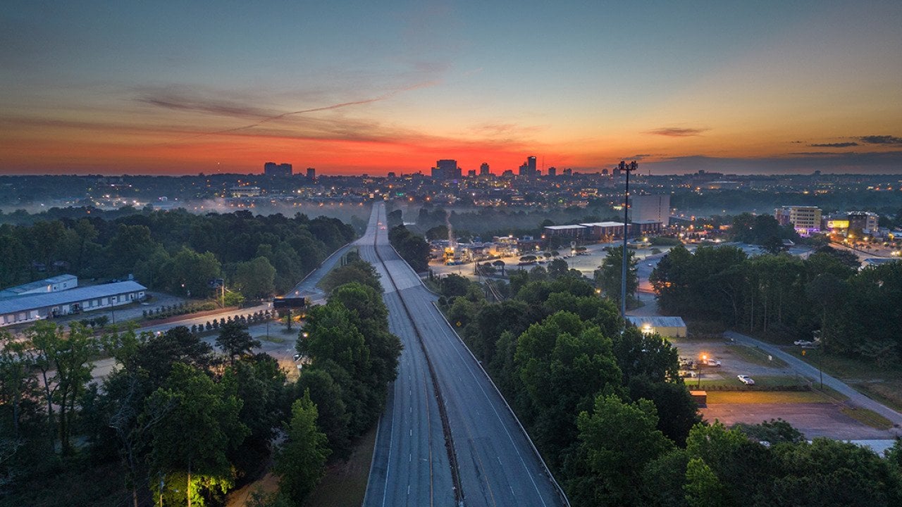 A top view of a highway into Columbia, South Carolina, USA at dawn.