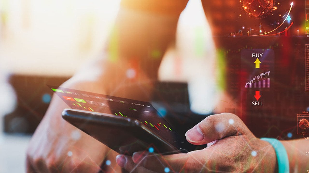 Person analyzing cryptocurrency data on a phone.