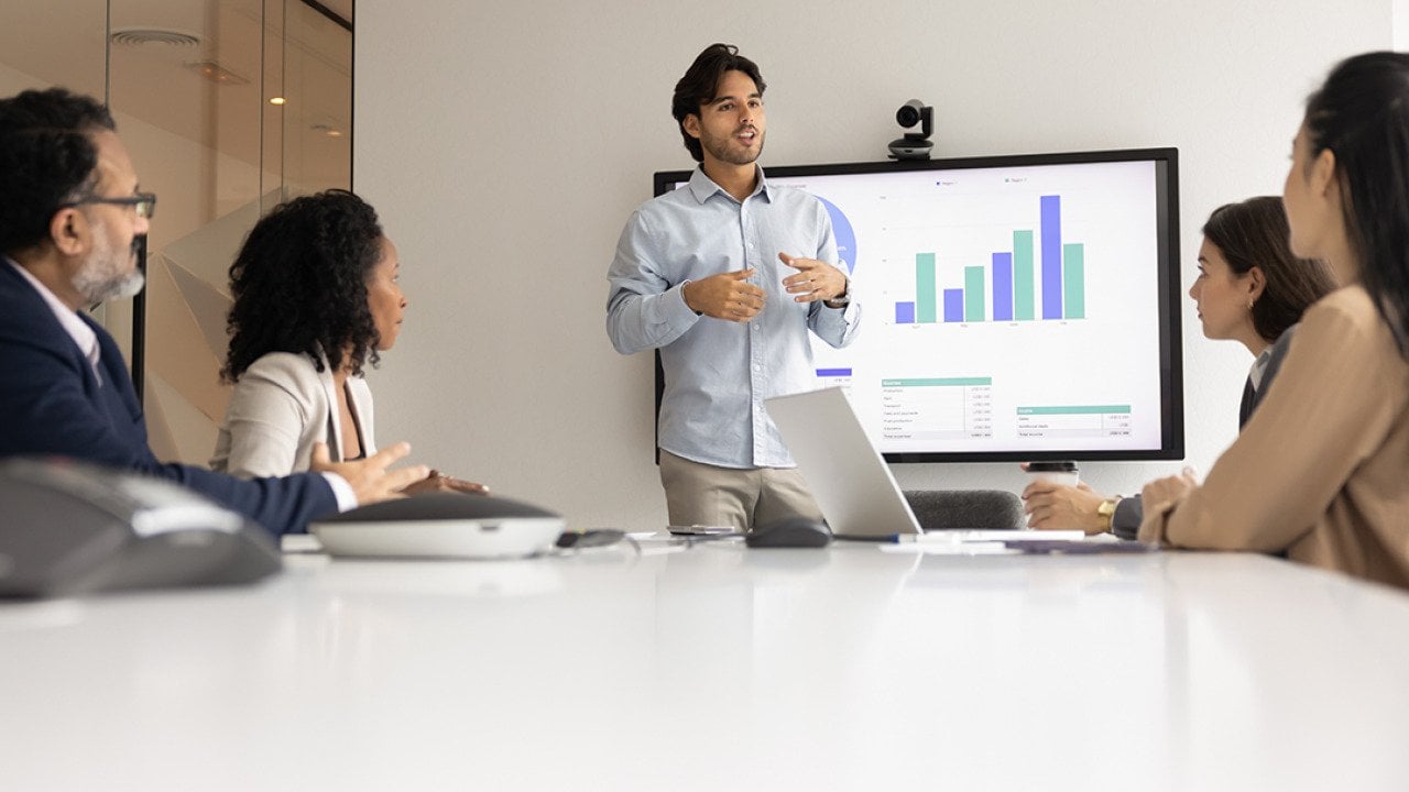 A speaker giving a presentation to a business team.