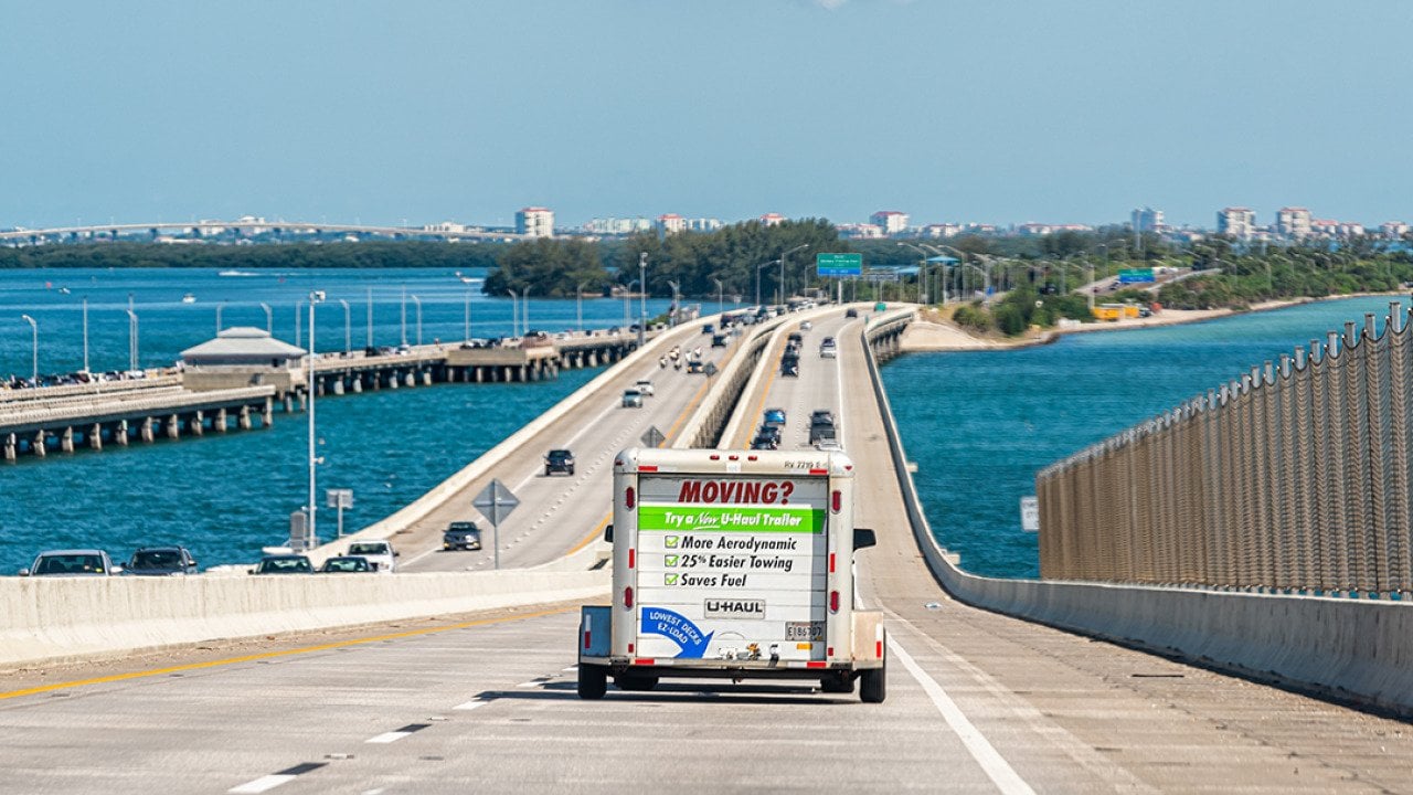 A U-Haul trailer truck crossing the Tampa Bay bridge in Florida.