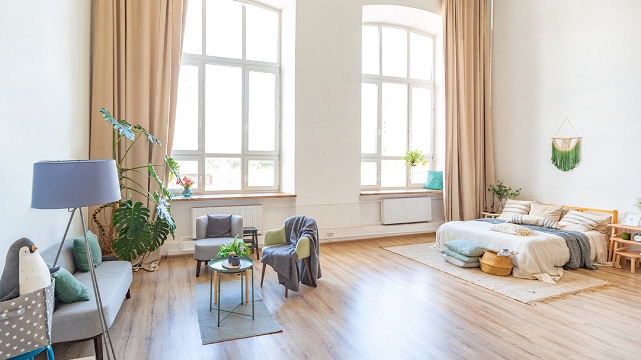 A spacious apartment with a Scandinavian style interior.