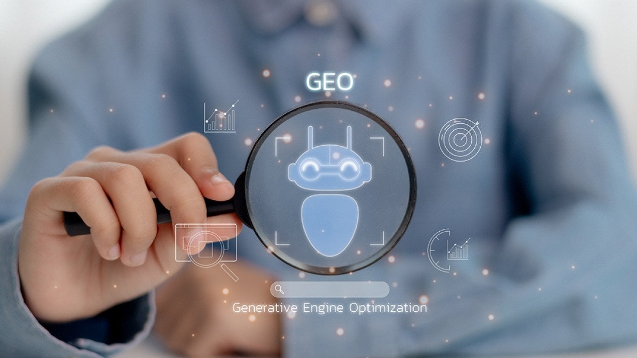 Person holding a magnifying glass illustrated with GEO concept graphics.