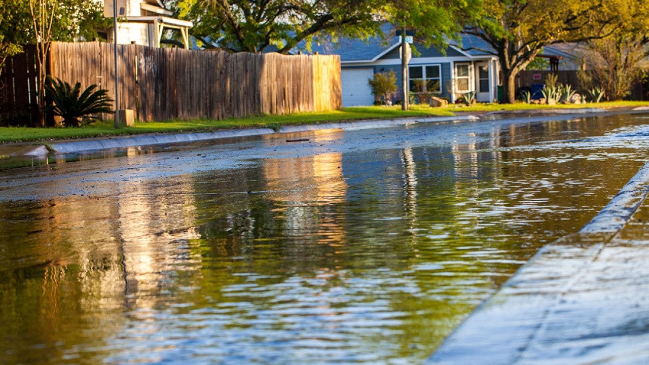 A shallow flood formed along a neighborhood after a thunderstorm.