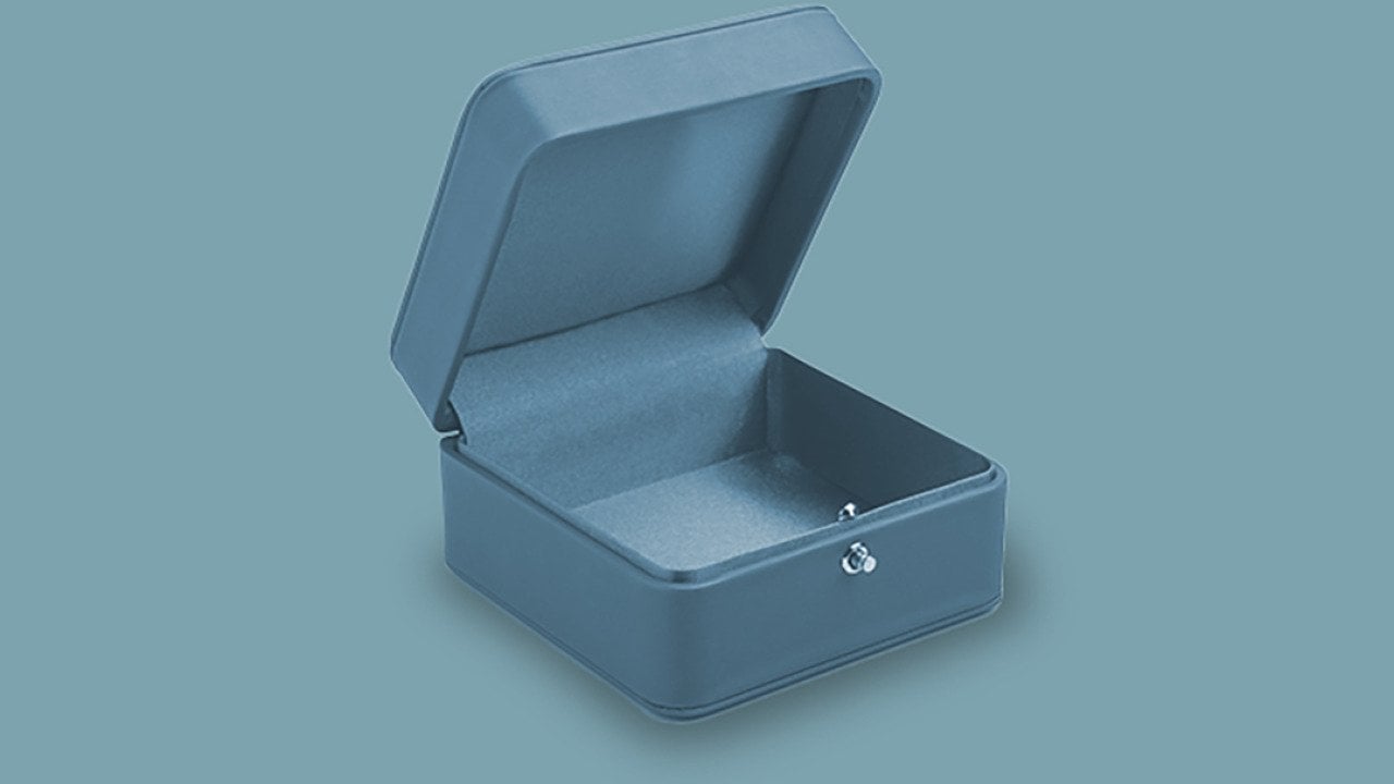 An empty teal jewelry box.