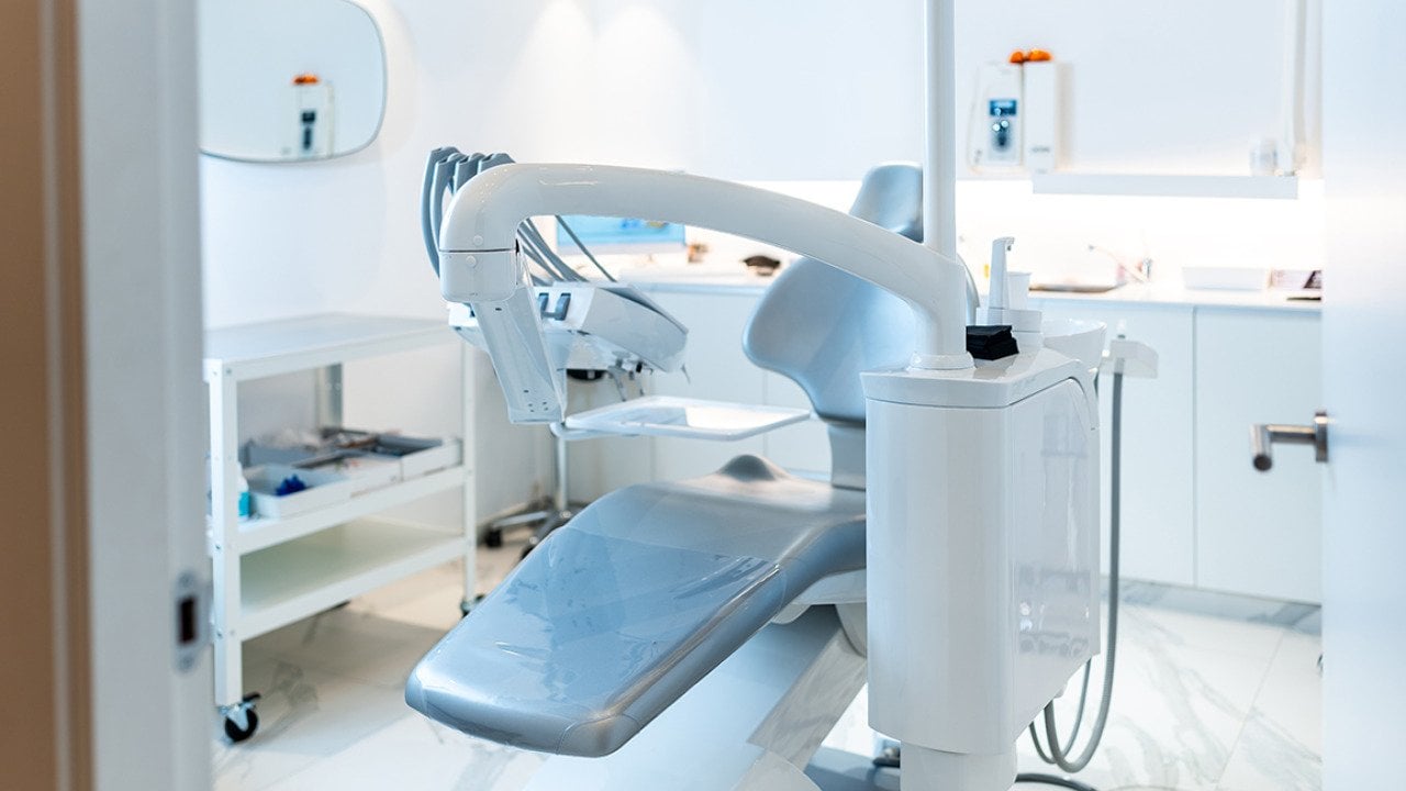 An empty dental patient's chair in a modern dental clinic.