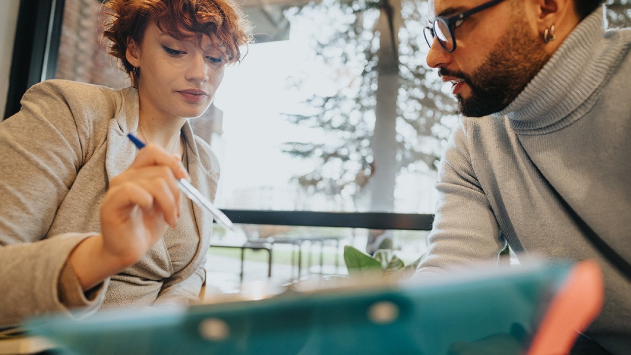 A diverse business team engaged in a discussion.