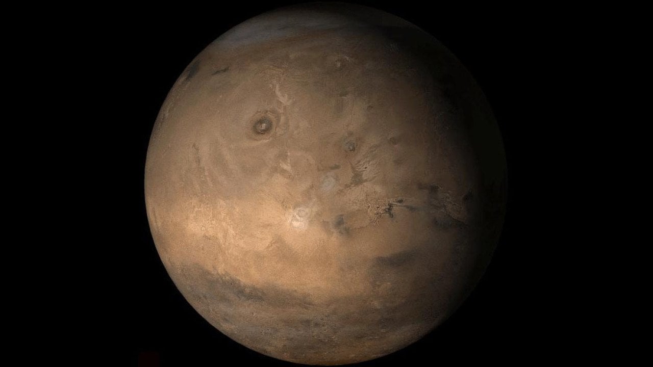 An Image from NASA showing the Tharsis face of Mars, a vast volcanic plateau centered near the equator in the western hemisphere of the planet.