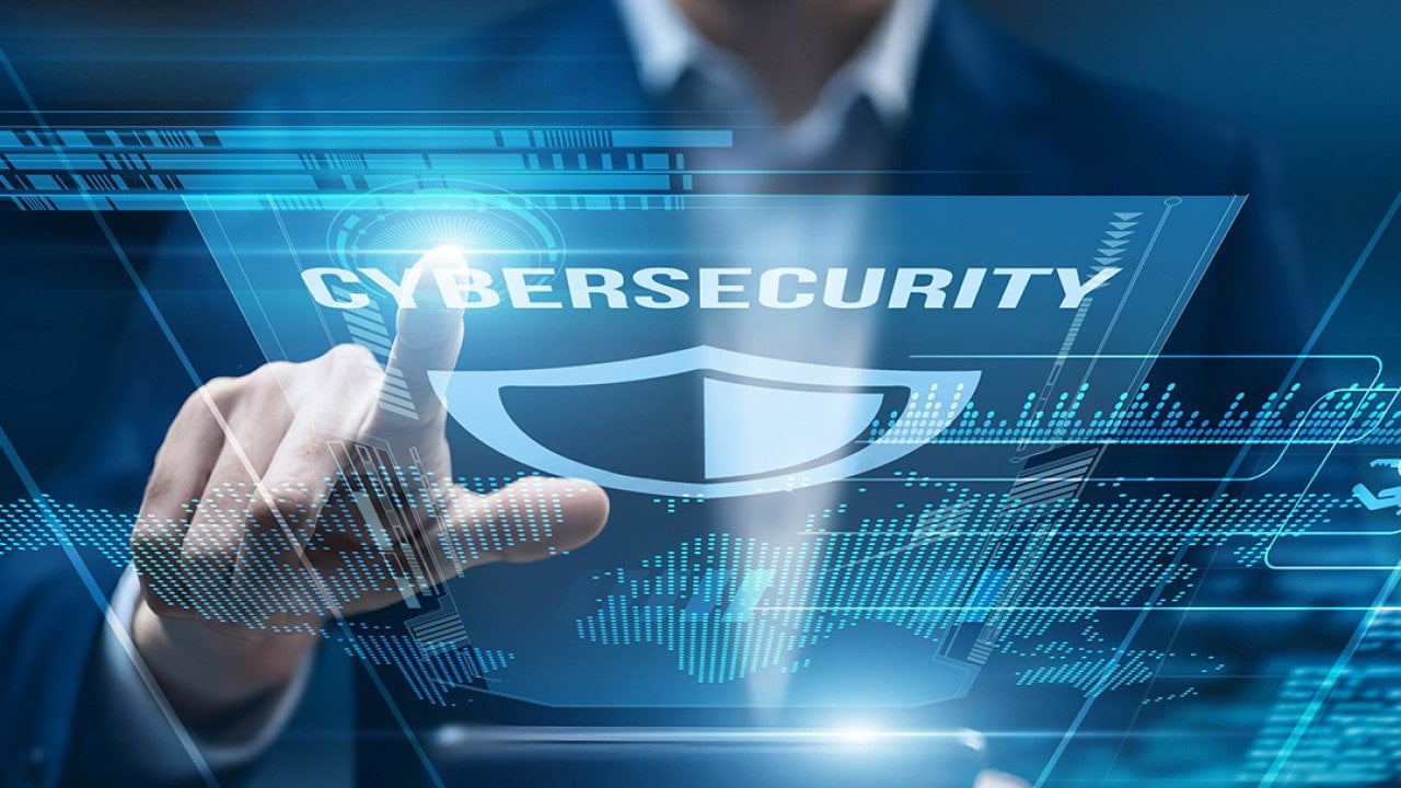 A cybersecurity analyst using a smart tablet for performance monitoring.