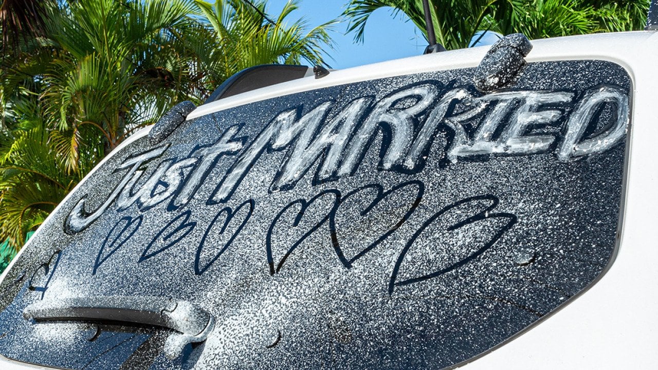 'Just married' written on a car window.