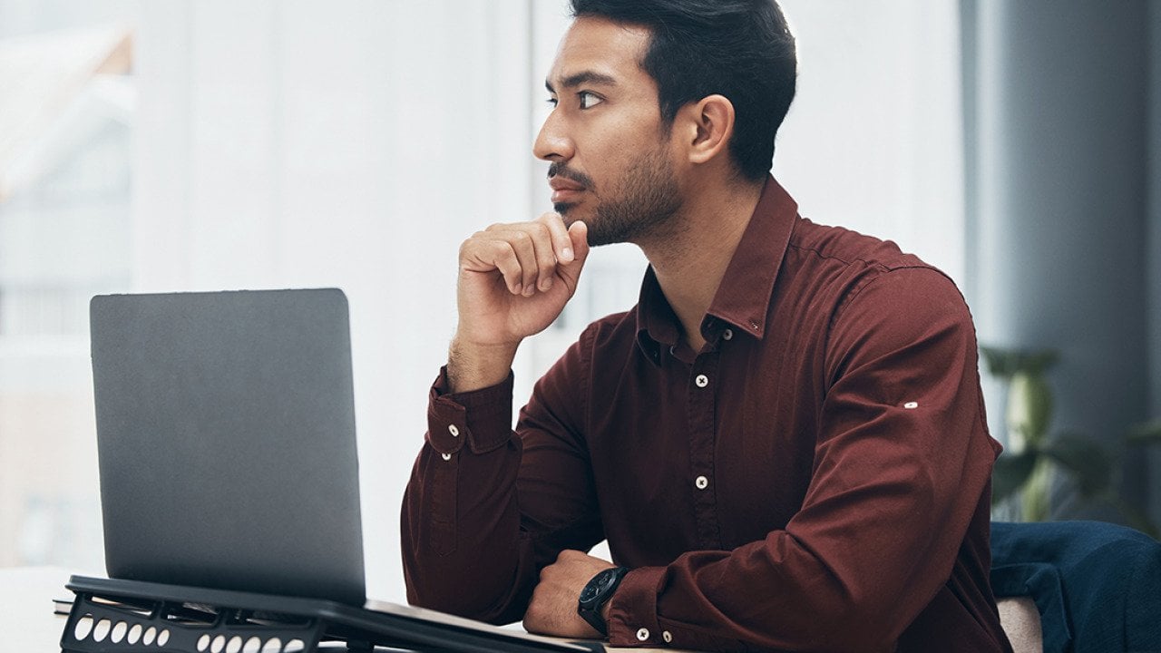 A business employee planning on solutions for a work project in an office.l