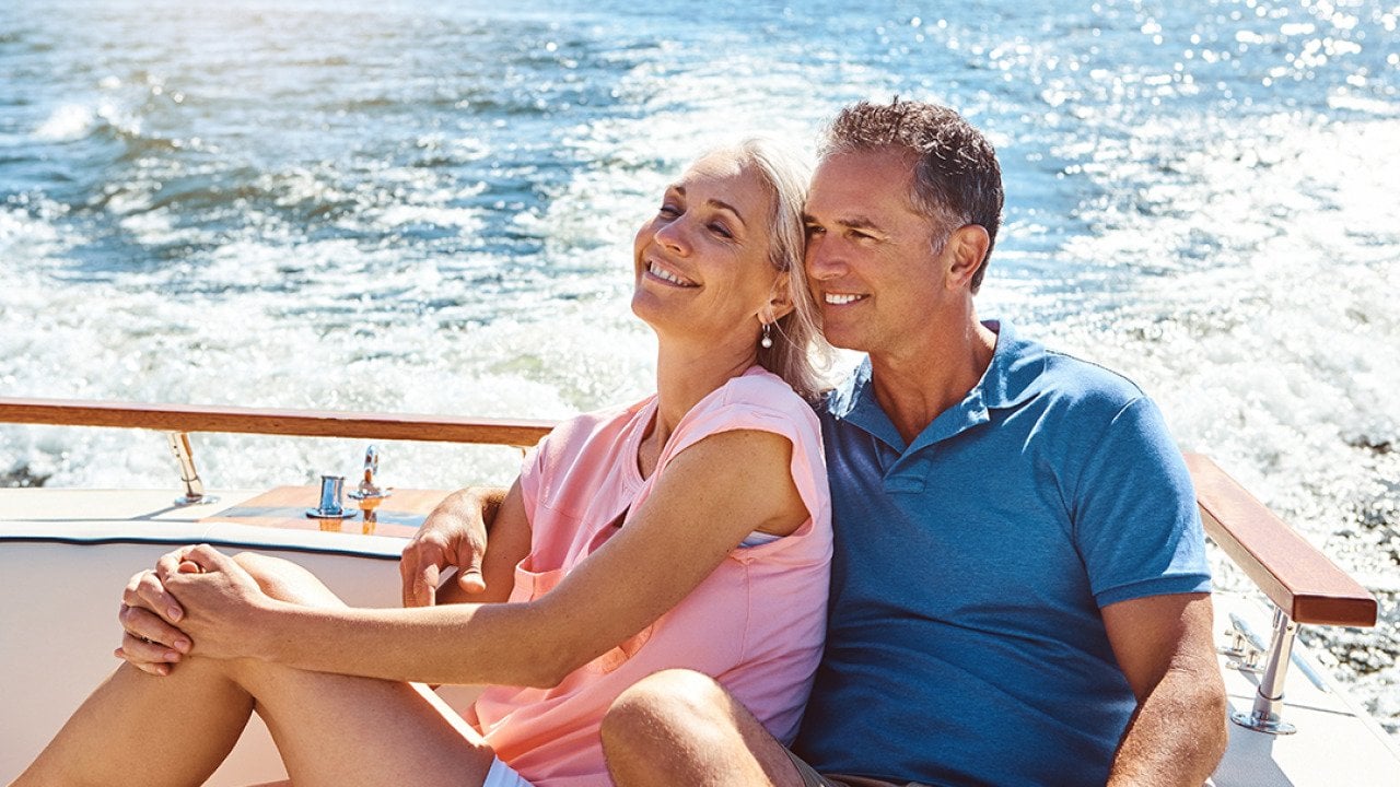 A couple enjoying their vacation time in a yacht trip.