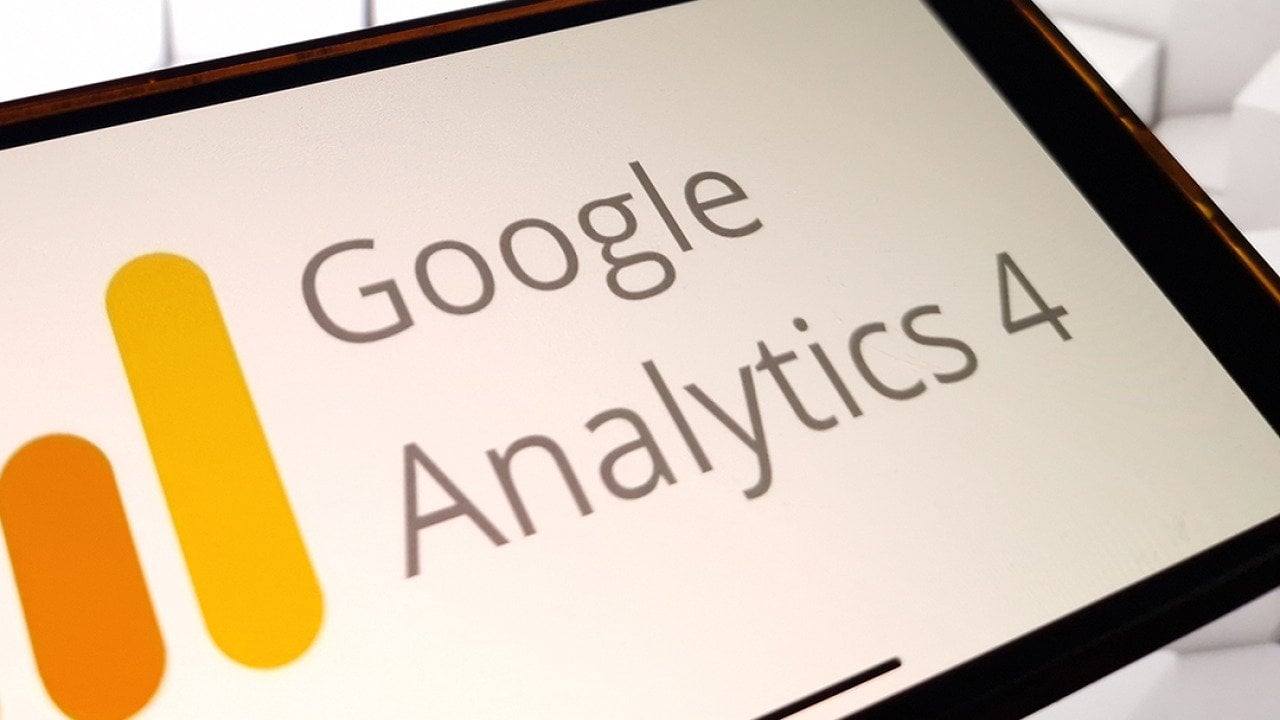 The Google Analytics 4 platform logo displayed on a smartphone.