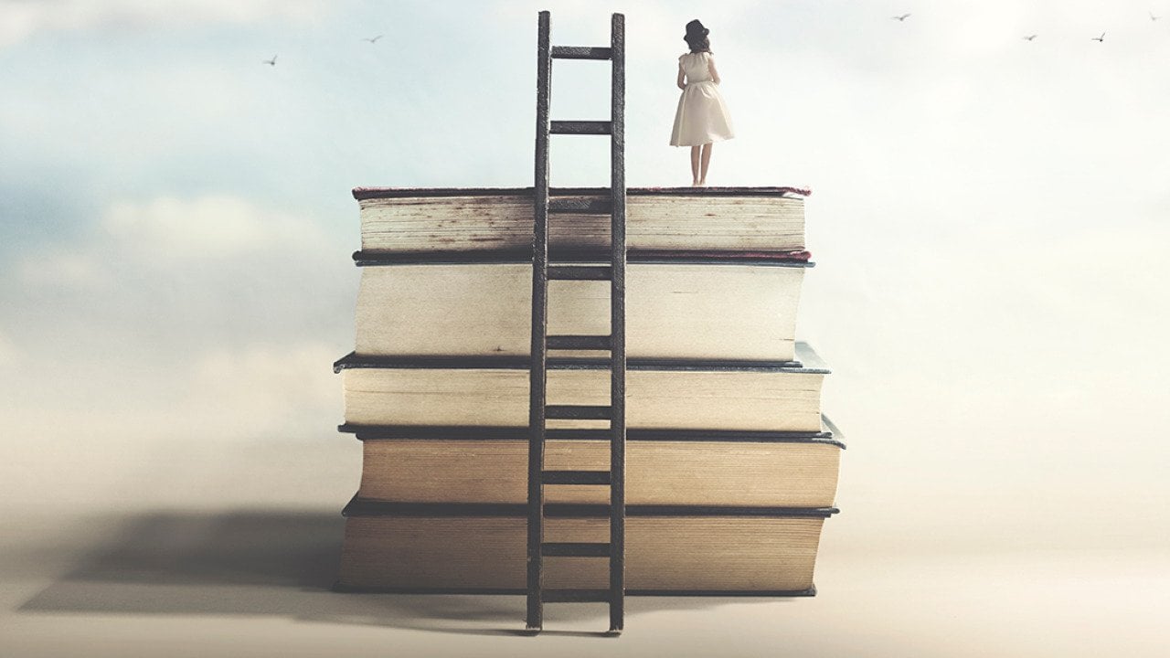A girl on top of a pile of books with ladder as a concept of achieving education and wisdom.