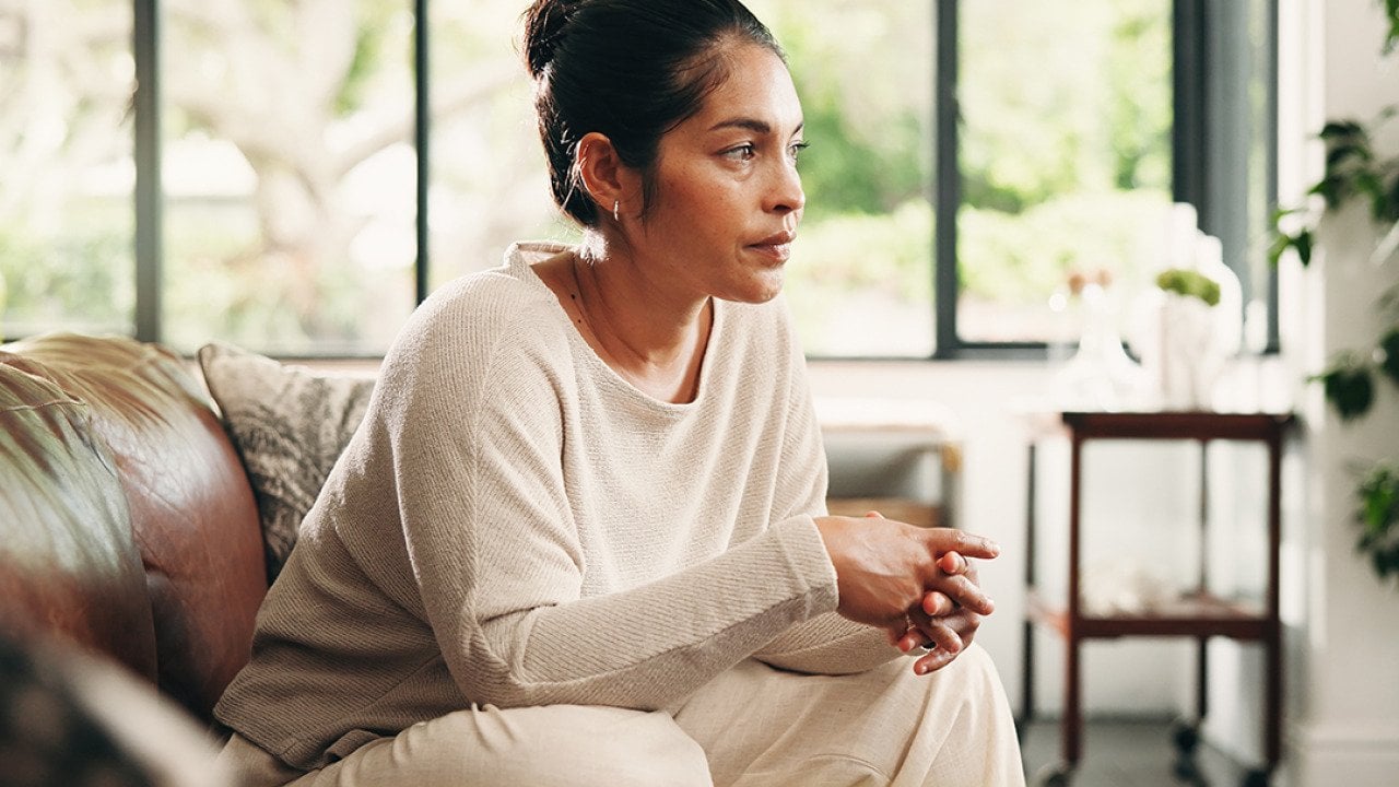 A person taking her time for calm contemplation and reflection at home.