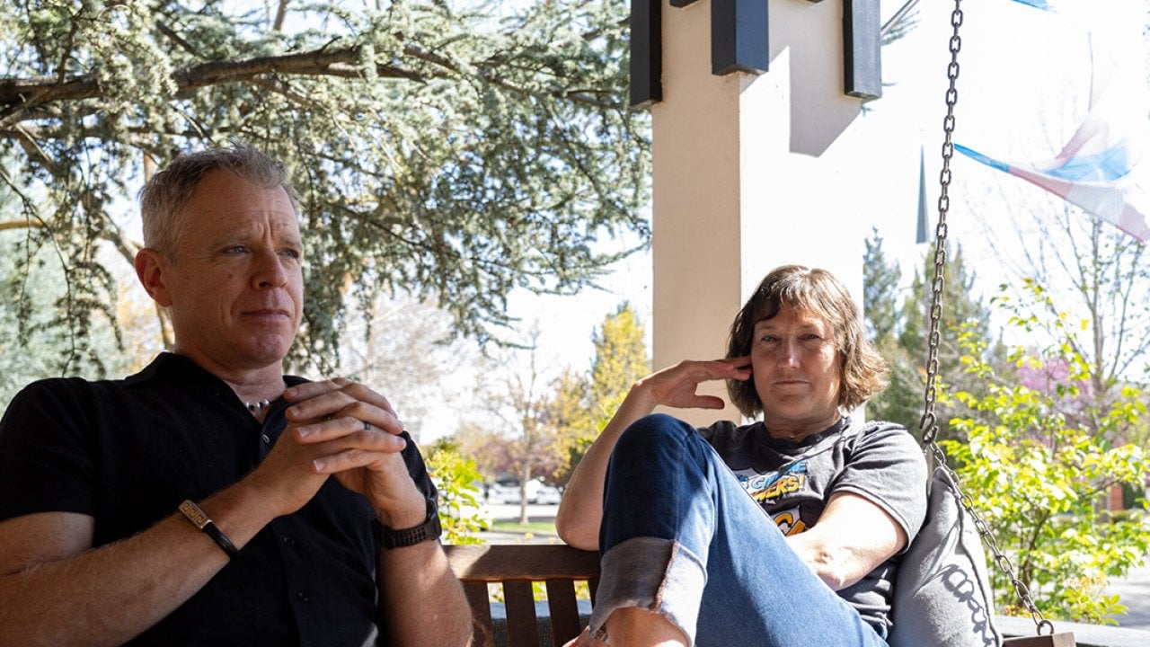 Michael and Dr. Angie Devitt taking their time for some reflection at a balcony.