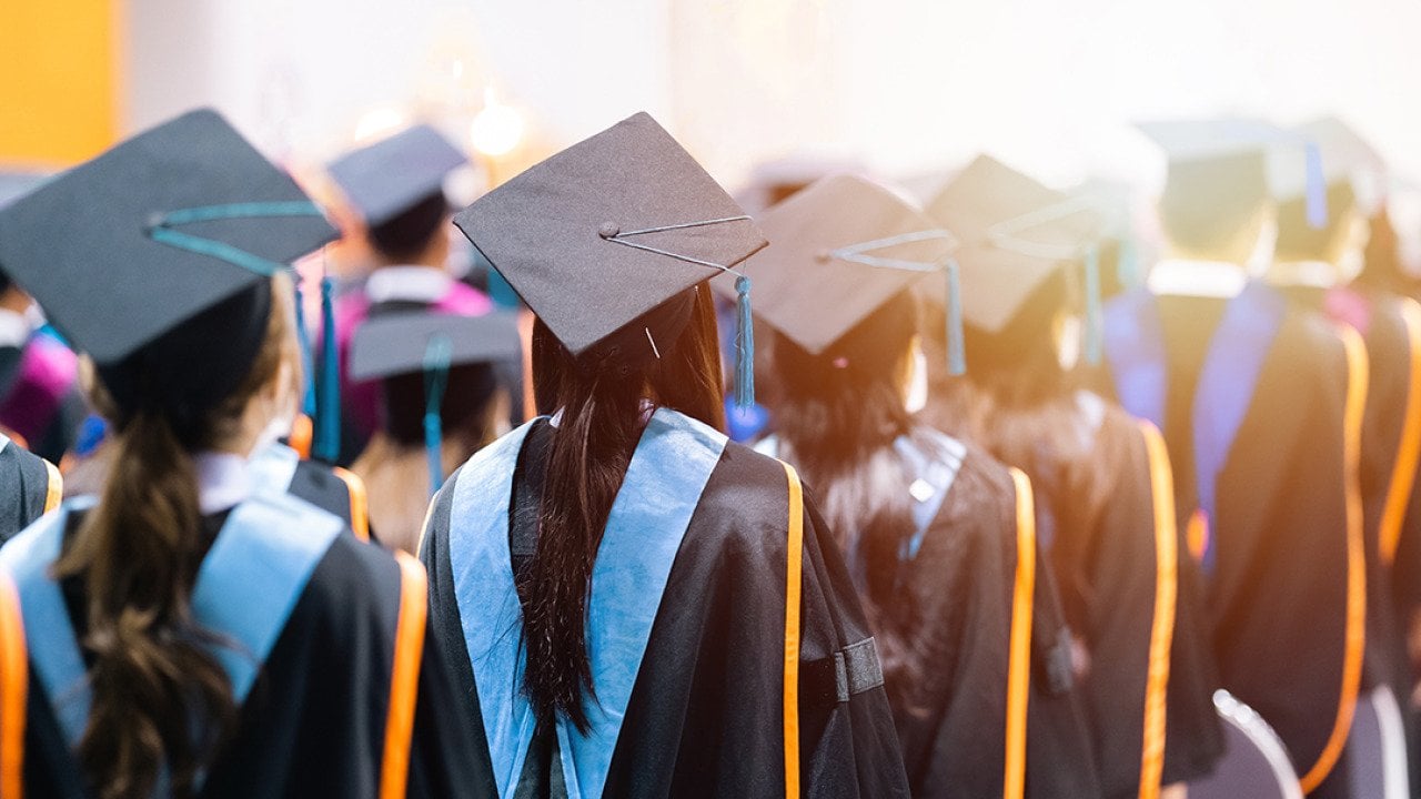 University graduating students lined up during commencement day.