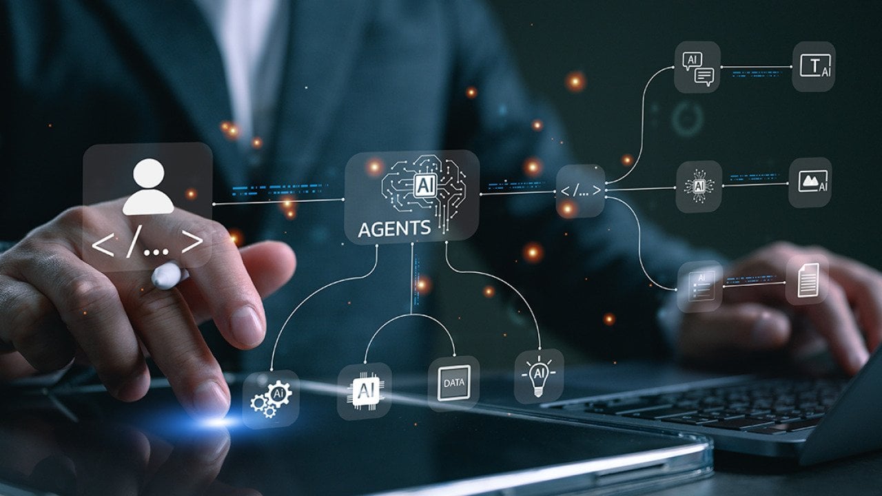 Agentic AI workflow graphics over a businessman using a laptop and tablet for productivity.